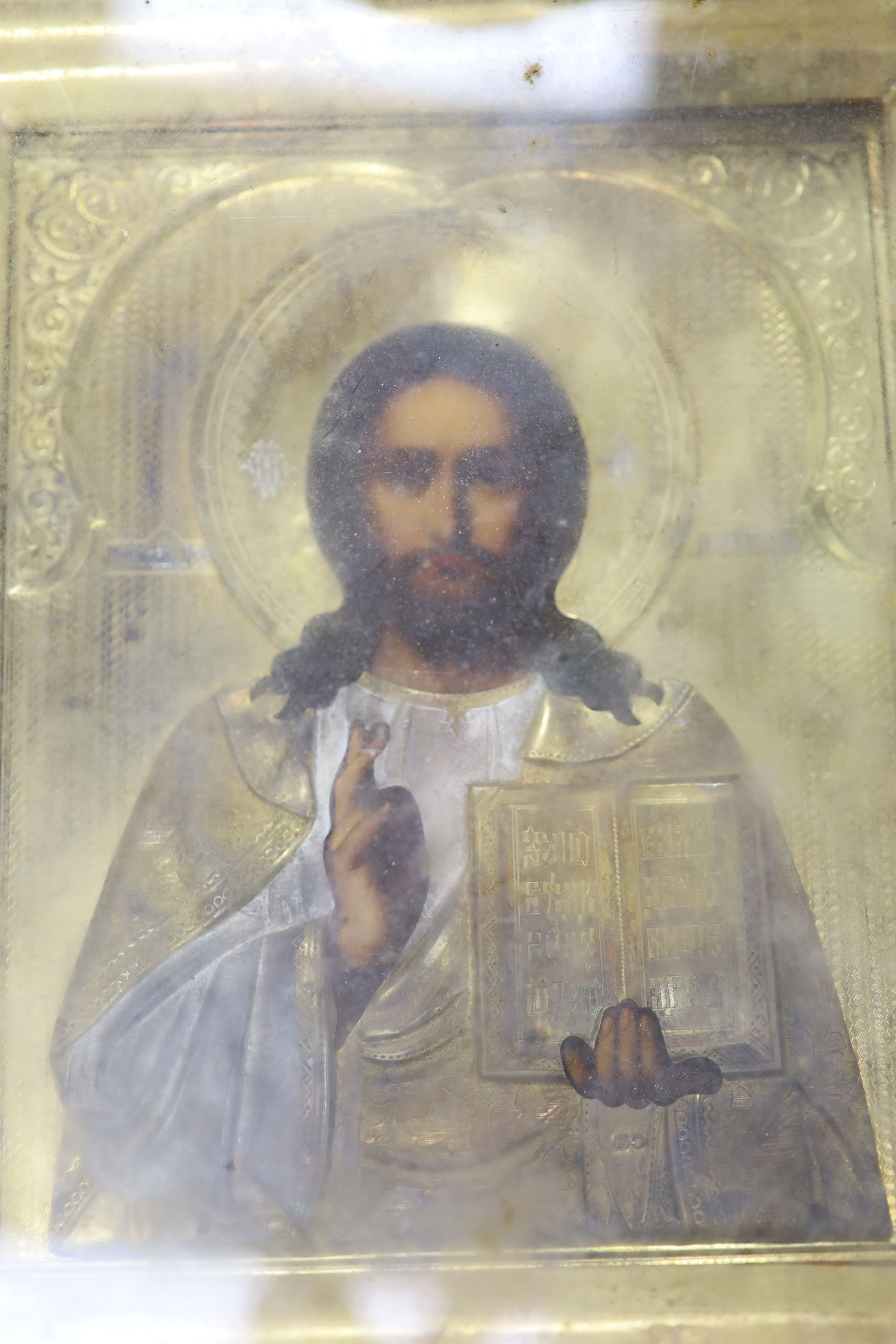 19th century Russian School, tempera on panel, Icon of Christ Pantocrator, with gilt oklad, 22 x 18cm, overall 29 x 25cm